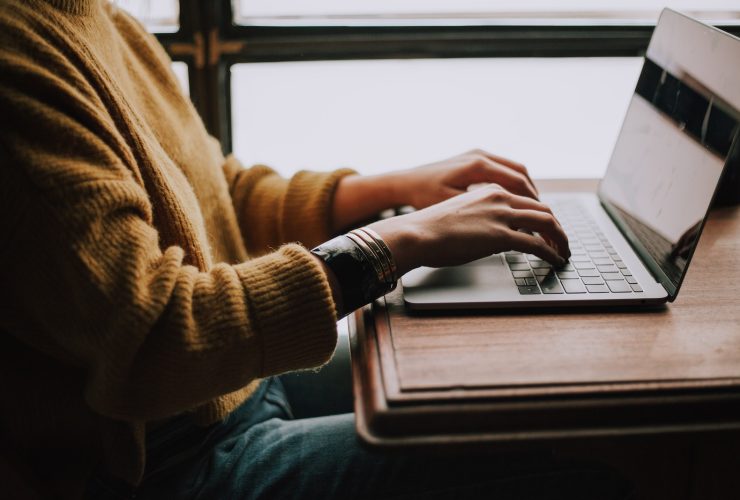 person sitting front of laptop