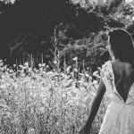 grayscale photography of woman in backless wedding gown