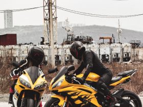 man in black helmet riding yellow sports bike during daytime