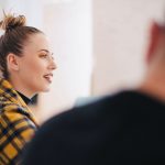 woman wearing yellow and black plaid shirt