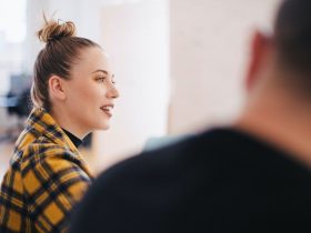 woman wearing yellow and black plaid shirt