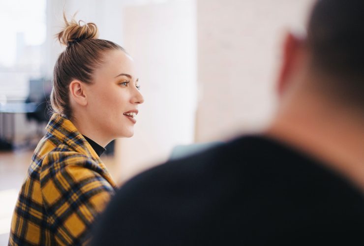 woman wearing yellow and black plaid shirt