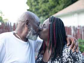 a man and woman kissing