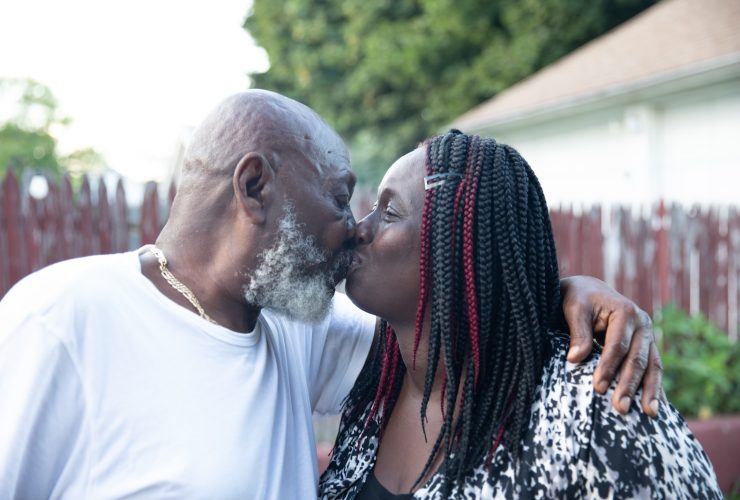 a man and woman kissing