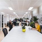 people sitting on black chairs