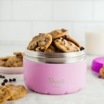 bunch of cookies in pink food container