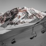 cable car above snow field