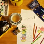 black and white ceramic mug on brown wooden table