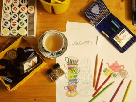 black and white ceramic mug on brown wooden table