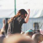 woman on top of crowd