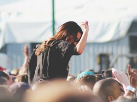 woman on top of crowd