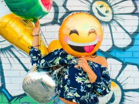 woman holding balloons