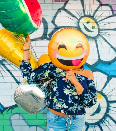 woman holding balloons