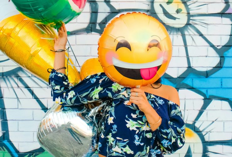 woman holding balloons