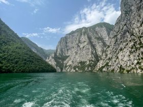 a body of water with mountains in the background