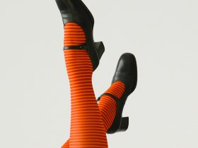 woman wearing pair of black leather chunky-heeled shoes