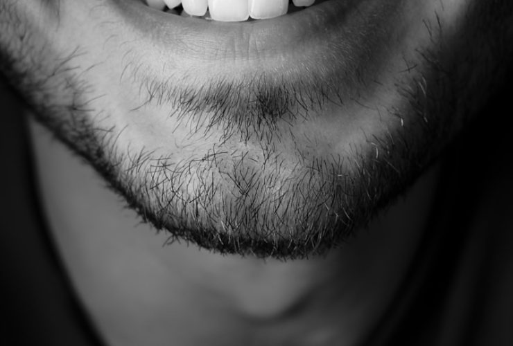 grayscale photo of mans face