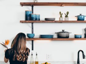 woman standing in front of kitchen sink