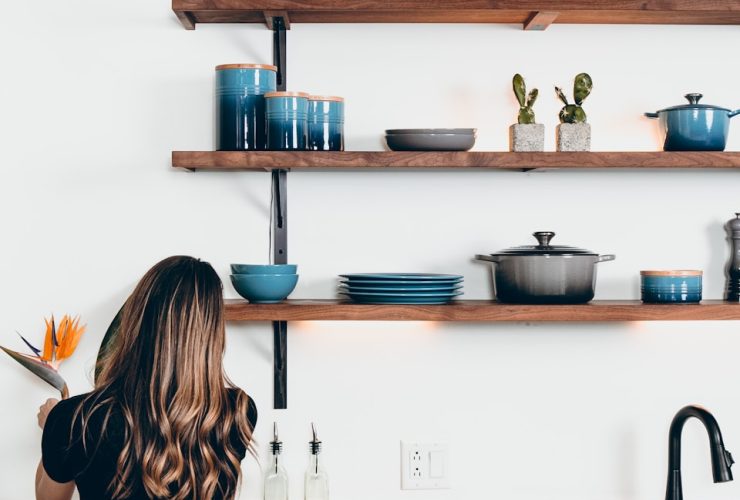 woman standing in front of kitchen sink