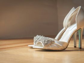 pair of silver open-toe stilettos on brown surface