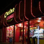 a lit up store front at night with a lot of lights