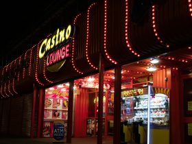 a lit up store front at night with a lot of lights