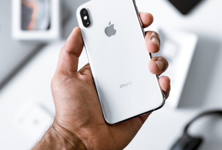 person holding silver iPhone X
